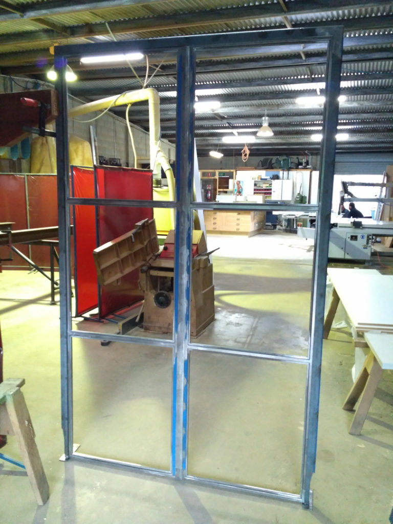 steel glass industrial doors bangalow being made